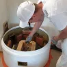 Tiileri masonry heater kit being assembled with guidance